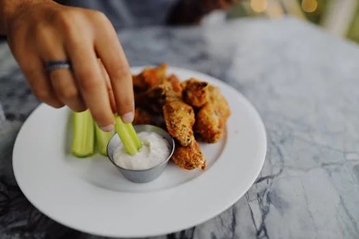 buffalo chicken wings with celery sticks